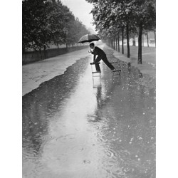 MAN CROSSING PUDDLE ON CHAIRS, 1934