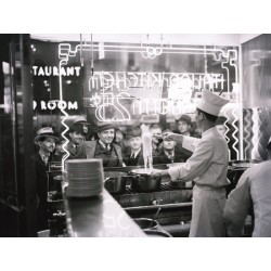 A COOK PREPARING SPAGHETTI, BROADWAY, NEW YORK CITY, 1937