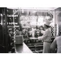 A COOK PREPARING SPAGHETTI, BROADWAY, NEW YORK CITY, 1937