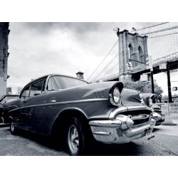 VINTAGE CAR PARKED BY CITY BRIDGE