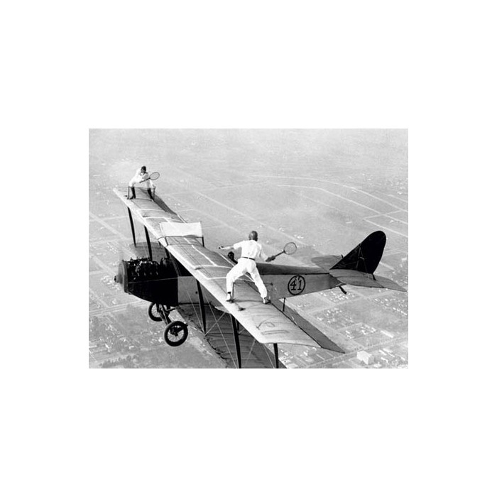 DAREDEVILS PLAYING TENNIS ON A BIPLANE, 1925