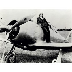 FEMALE PILOT STANDING ON AIRPLANE