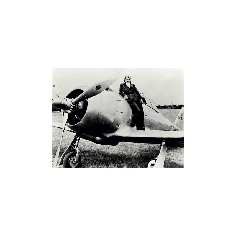 FEMALE PILOT STANDING ON AIRPLANE