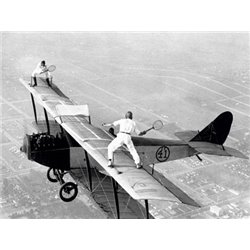 DAREDEVILS PLAYING TENNIS ON A BIPLANE, 1925
