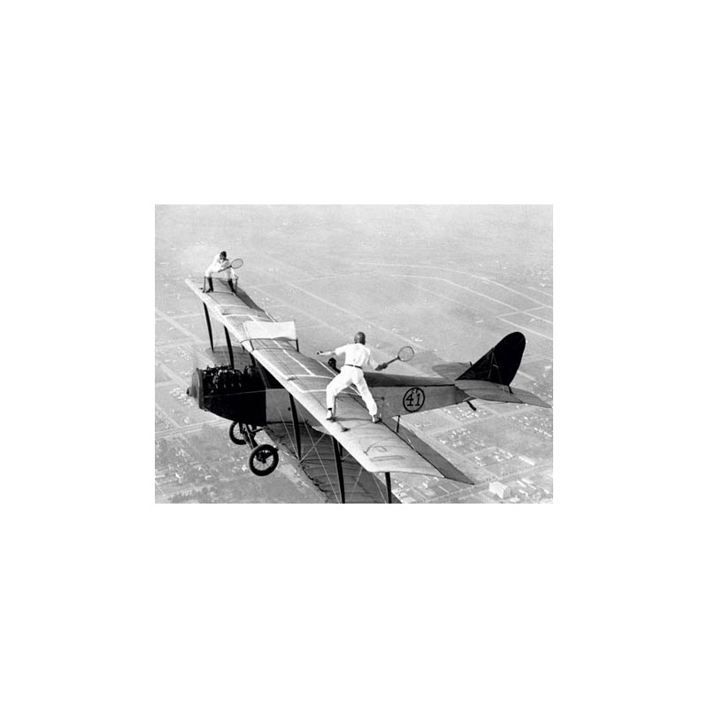 DAREDEVILS PLAYING TENNIS ON A BIPLANE, 1925